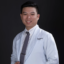 A picture in lab coat of Dr. Chu Santos, MD, FPOA